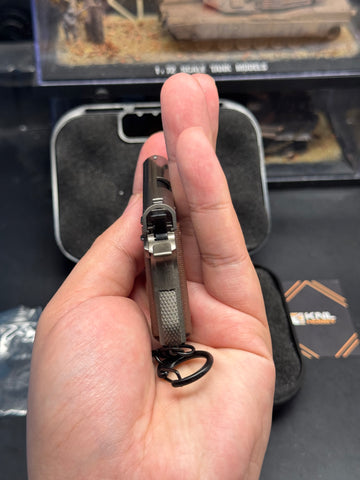 back M1911 metal model keychain 1/3 scale gray gunmetal color with bullet ejection function and storage suitcase